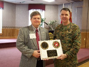 Dan Egge, outgoing chapter president (l), offers a token of appreciation to the January conference keynote speaker, Lt. Gen. Keith J. Stalder, who presented his thoughts on command and control and lessons learned from Iraq.